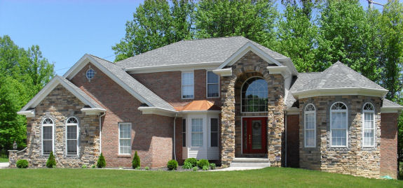 1st floor master suite with vaulted ceilings, 2 walk-in closets, and a glamour bath. 1st floor den/guest bedroom with 10' ceiling. Bridge overlooks 2-story foyer and great room with wall of windows and loft above. Formal dining room with bay and tray ceiling. Large kitchen with corner window sink, huge breakfast bar, and walk-in pantry. Cathedral morning room with windows all around. 1st floor laundry. Covered arched entry. 2-car side-entry garage.