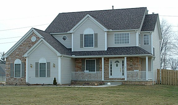 2 story foyer. Dining room/parlor/study. Walk-in pantry. Master bedroom and sun room with cathedral ceilings. 1st floor laundry/mud room. Wrap-around porch. 2-car side-entry garage.