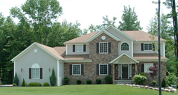 9' ceilings on 1st floor. Large 1st floor master suite with boxed ceiling and large walk-in closet. 2 story foyer and great room with bridge above. Loft overlooks great room and foyer. Large kitchen/dinette area with walk-in pantry. Tray ceiling in formal dining room and parlor. Side entry 3-car garage.