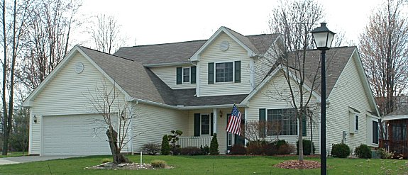 1st floor Master with 9' Trayed ceiling, Sloped ceiling in Great Room, Formal Dining room, 1st floor Laundry, Covered porch, 2 car garage