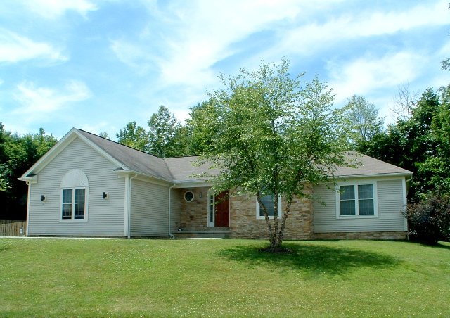 1st floor laundry. Large cathedral great room. Kitchen with breakfast bar. Master bedroom with separate shower and garden tub. Front bedroom can be parlor/den. Covered front porch. 2-car garage.