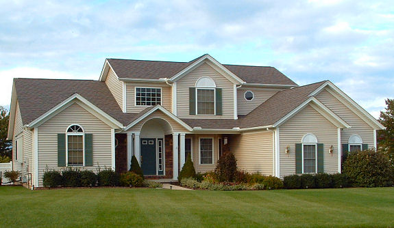 1st floor master bedroom with 9' trayed ceiling. 1st floor den or 4th bedroom. Cathedral ceiling in great room with transom windows and optional skylights. 2 story foyer. Formal dining room or parlor with trayed ceiling. Arched covered front porch. Large covered rear porch. 1st floor laundry. 2-car garage.