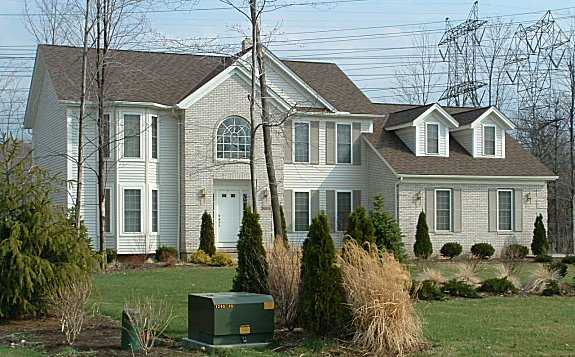 Partial brick or stone front. 1st floor laundry room. Mud room with large closets. Large master bath and walk-in closet. Large master bedroom with cathedral ceiling and sitting room.  Sunk-in family room with 9 ft. ceiling. Bayed formal dining room. 1st floor study/den. 2-car garage with storage area.