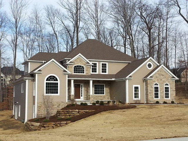 1st floor master with vaulted ceilings, 2 walk-in closets, and glamour bath. 1st floor den/guest bedroom with cathedral ceilings. Bridge overlooks 2 story foyer and great room with wall of windows and loft above. Formal dining room with tray ceiling. Large kitchen with corner window sink, huge breakfast bar, and walk-in pantry. Cathedral ceilings in the morning room with windows all around. 1st floor laundry. Large covered porch. 2-car side-entry garage.