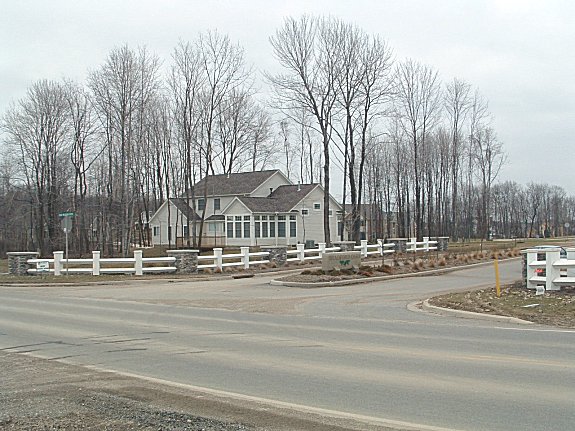 The entrance road into the Bradford Oaks development.  A former LDA model can be seen in the backround